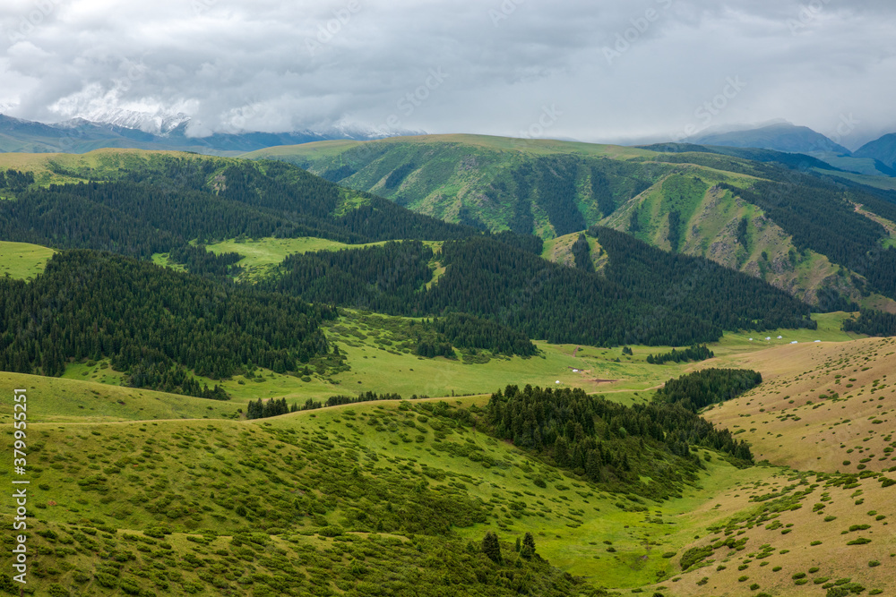 Green summer mountain landscape with clouds from Assy Plateau in Kazakhstan