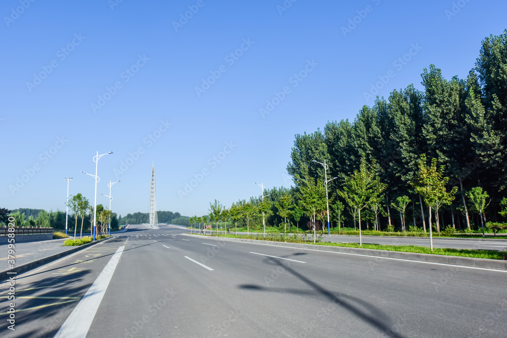 Fototapeta premium Asphalt roads and Bridges, sidewalks, and skylines against a backdrop of blue sky