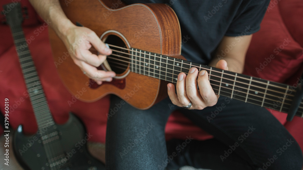 Man playing acoustic guitar Man playing acoustic guitar