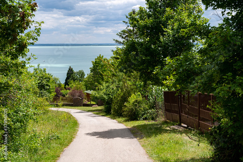 Hungarian landscape with the view of lake Balaton and a local rural street