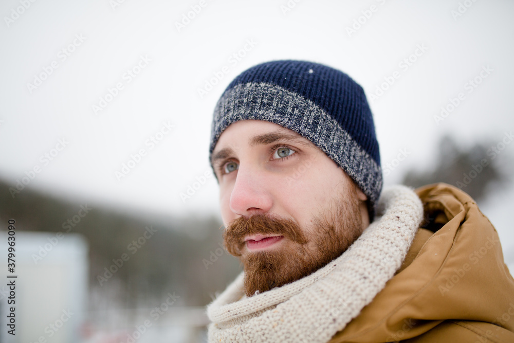 Winter portrait of a young handsome bearded man Winter portrait of a young handsome bearded man