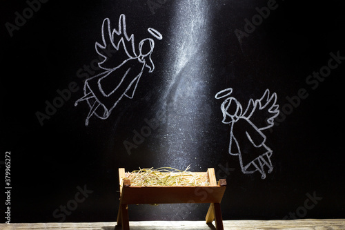 Fotografie, Obraz Birth of Jesus, manger and angels on blackboard abstract christmas nativity scen