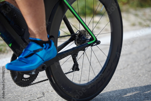 closeup of triathlon athlete riding bike