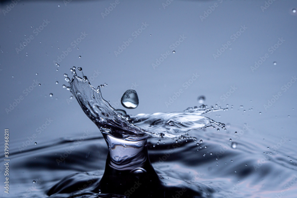 Water drops collision on a blue background. Abstract clear nature ...