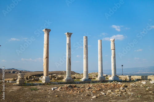 Remains of street columns in city Laodicea, Denizli, Turkey. All of them made in Corinthian order, left one made of marble. All city is included in UNESCO Tentative Heritage List