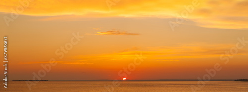 Sunset. Red sky and ocean, beautiful orange landscape panorama skyline background