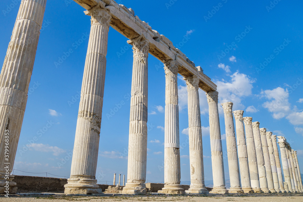 View in perspective onto antique street colonnade. All columns made in Corinthian order. Picture taken in ancient city Laodicea, near Denizli, Turkey View in perspective onto antique street colonnade. All columns made in Corinthian order. Picture taken in ancient city Laodicea, near Denizli, Turkey