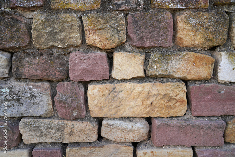 Hintergrund Steinmauer Natursteinmauer aus roten Steinen Hintergrund Steinmauer Natursteinmauer aus roten Steinen