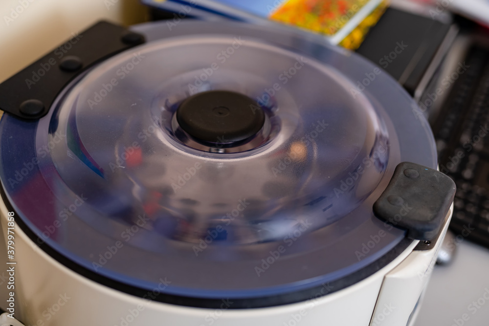 Blood samples for research in microtubes. Testing in laboratory. Centrifuge for blood analyzing. Chemical research. Blood samples for research in microtubes. Testing in laboratory. Centrifuge for blood analyzing. Chemical research.