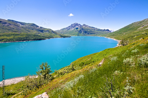 Summer view of the artificial Mont Cenis Lake, in the Savoy department near the italian border, in a clear blue sky morning