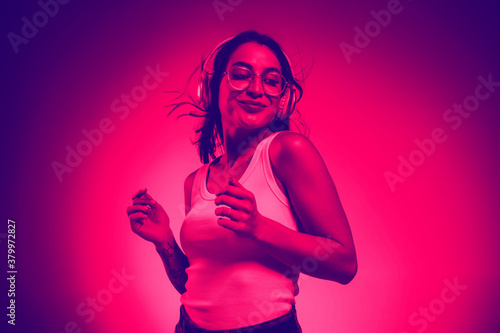 Dancing. Close up portrait of caucasian woman isolated on studio background. Modern and trendy duotone effect. Concept of human emotions, facial expression. Copyspace for ad. People in halftones.