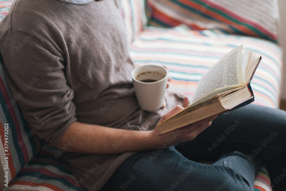 Man reading a book indoor Man reading a book indoor