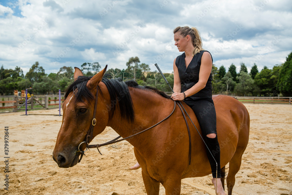 A woman rides her horse bareback A woman rides her horse bareback