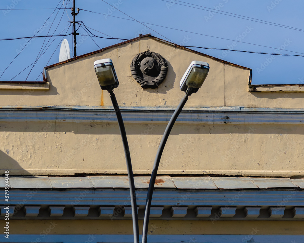 Old building with the coat of arms of the USSR