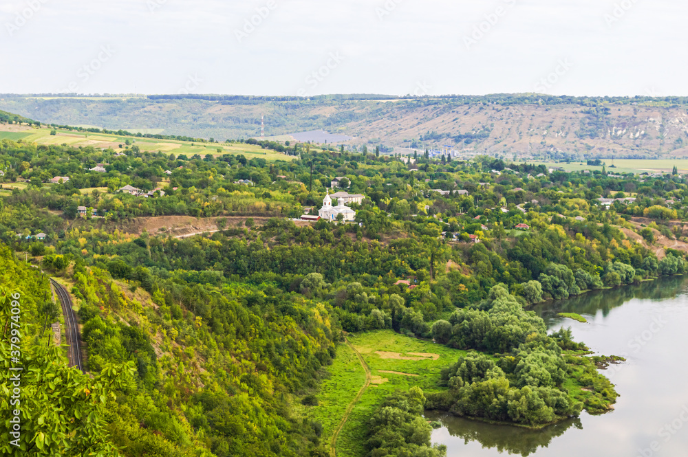 Moldavian village near the railway surrounded by forests on the banks of the Dniester River.