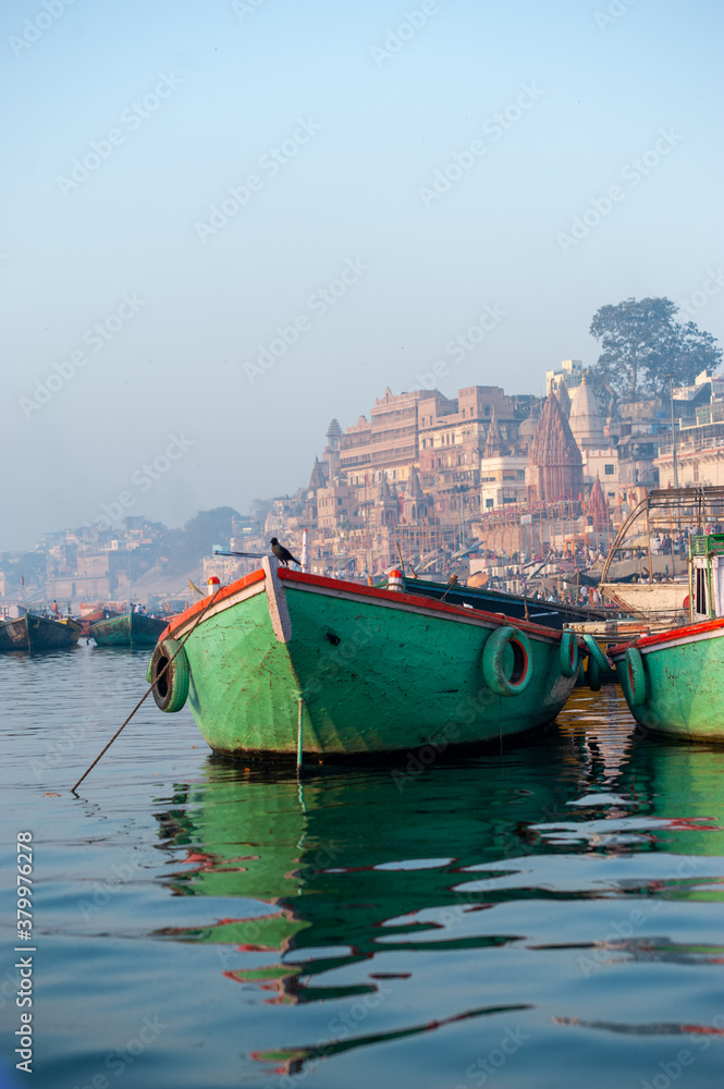 Green boat on river Ganges