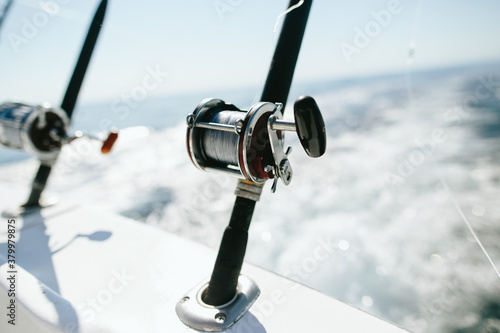 Fishing Rods And Spools Trolling From Back Of Boat