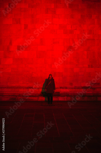 Illuminated building with red light photo