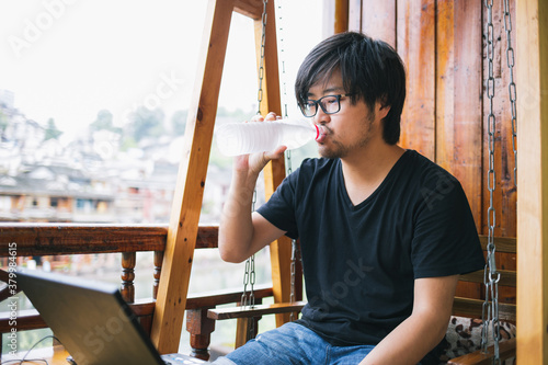 The young man is working in the hotel photo