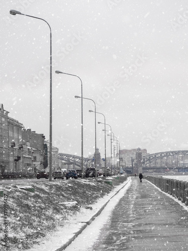 Empty winter embankment in Saint Petersburg with a view of the Neva river