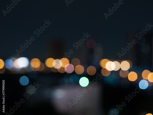 Night bokeh light building in city, abstract blur defocused background. © Bank