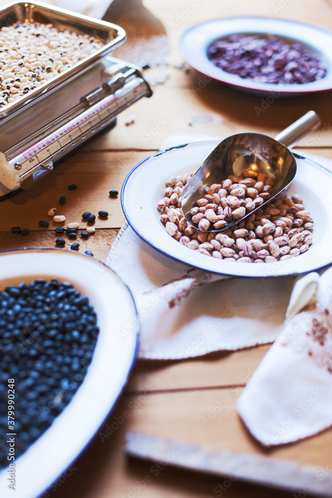 Dry beans on a scale and plates. Dry beans on a scale and plates.