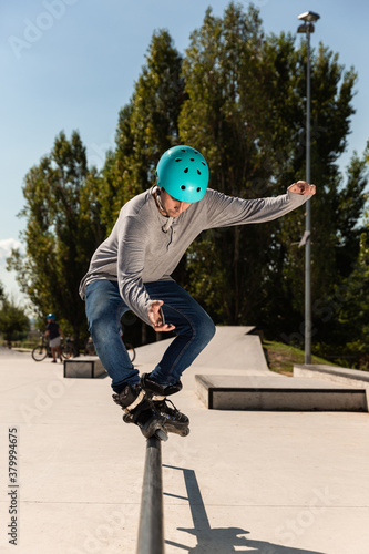 a roller skater does a trick on a ramp at a skate park