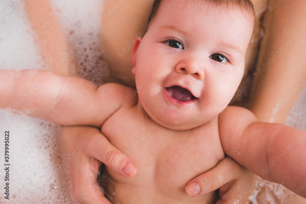Mom and Infant Baby Girl Enjoying a Bath Together Mom and Infant Baby Girl Enjoying a Bath Together