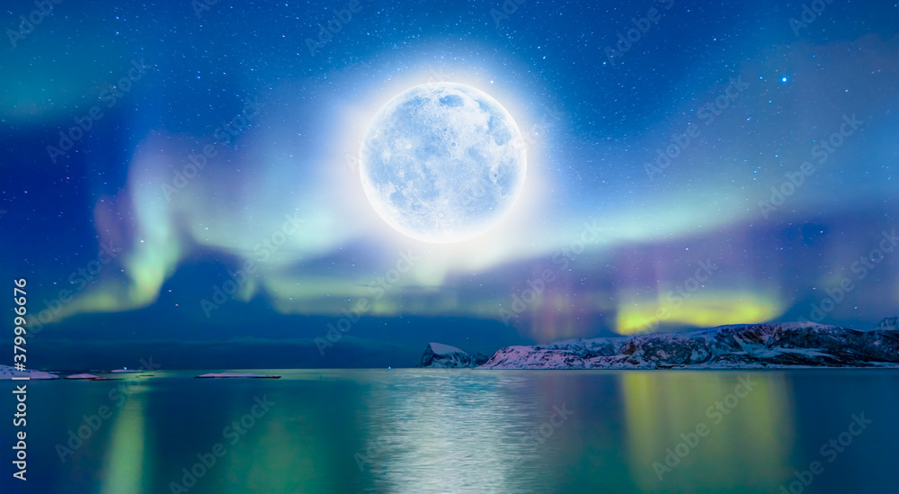 Fototapeta premium Northern lights (Aurora borealis) in the sky with super full moon - Tromso, Norway 