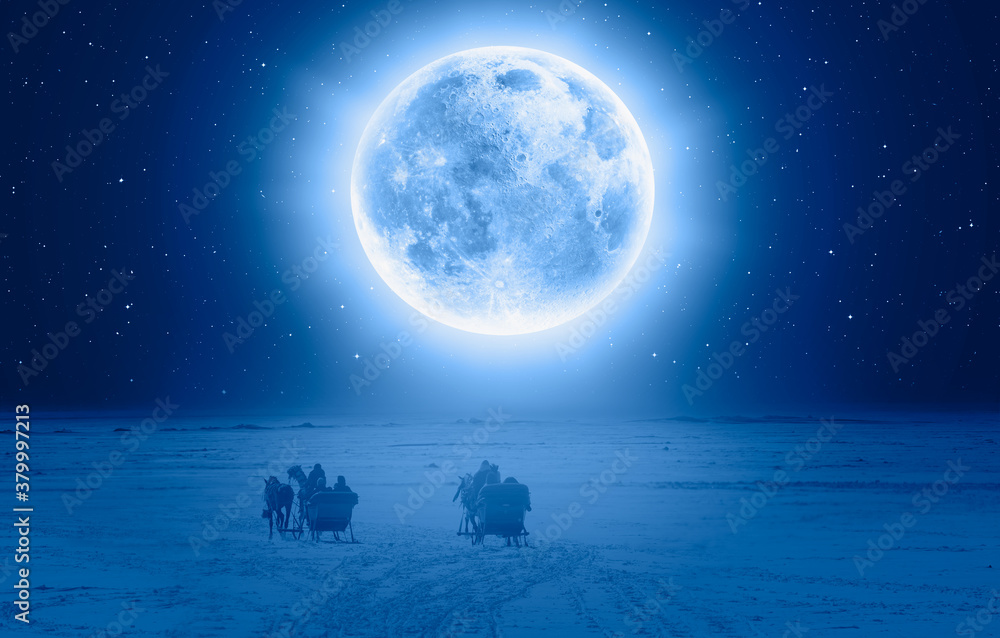 Horses pulling sleigh in winter Full Blue Moon in the background - Cildir Lake, Kars 