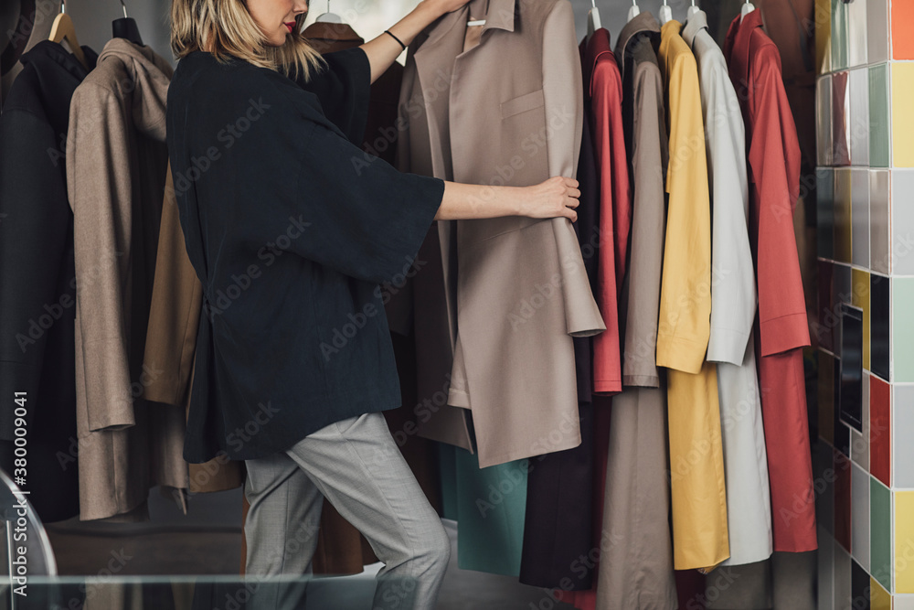 Woman Taylor Looking at Clothes Woman Taylor Looking at Clothes