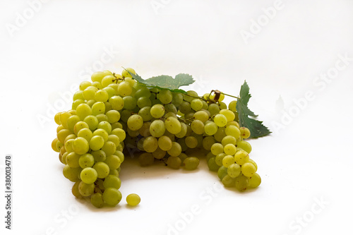 Yellow grapes on a white background