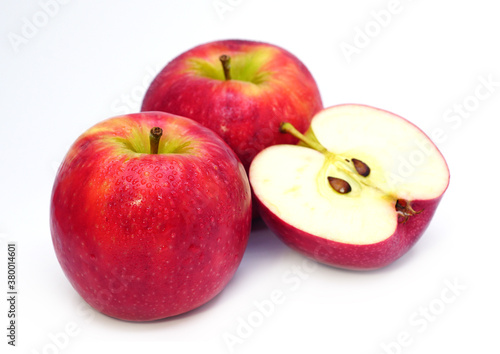 Ripe red apple fruit with apple half on white background. 