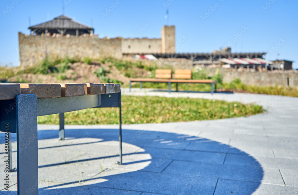 Bench in the park and castle in the background 