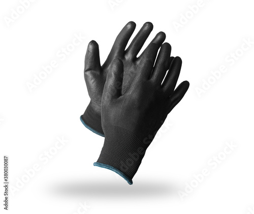 Pair of black protective work gloves isolated on white photo
