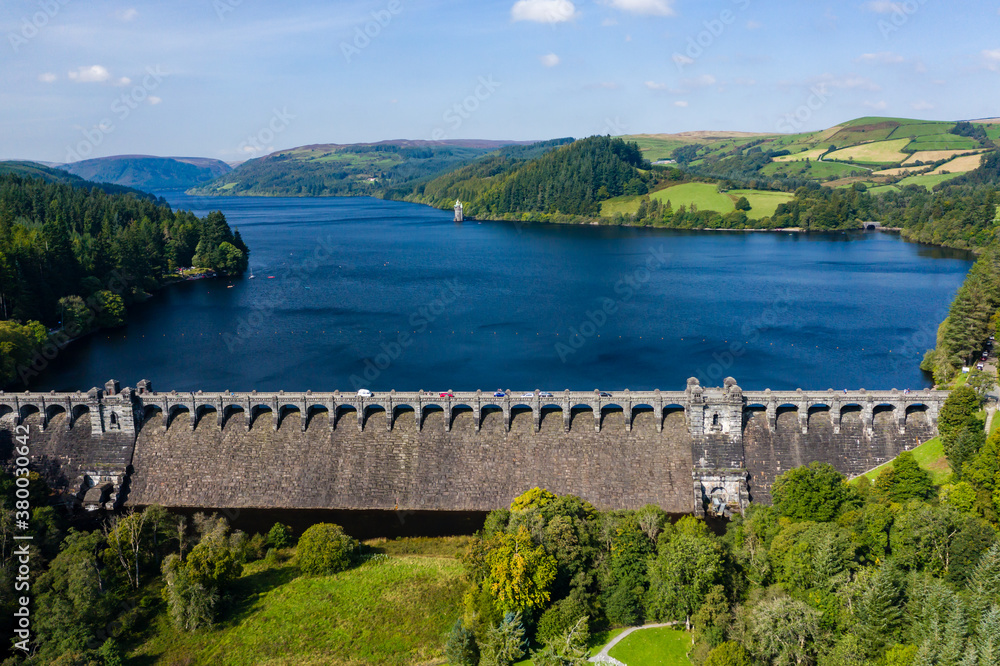 Aerial view of a dam wall and huge reservoir in a rural setting (Lake Vyrnwy, Wales)
