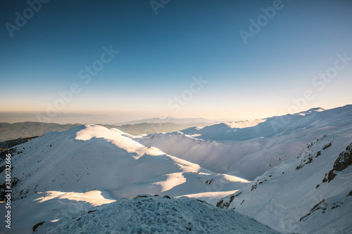 snowcovered mountains of parnassos at sunrise - greece photo
