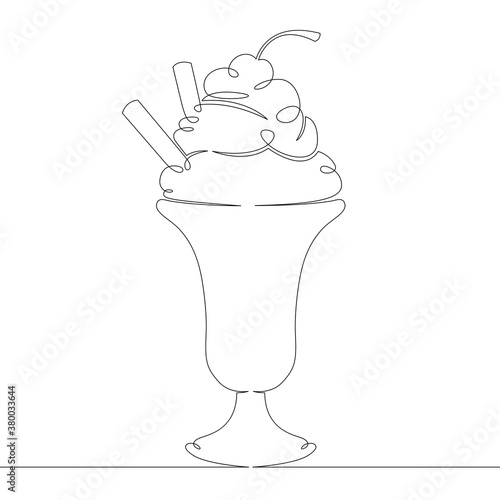 ice cream with fruit and cookies filling in a glass goblet