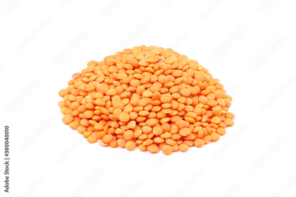 Orange lentils isolated on a white background. Heap of raw red lentil. Vegan food. Healthy food Orange lentils isolated on a white background. Heap of raw red lentil. Vegan food. Healthy food