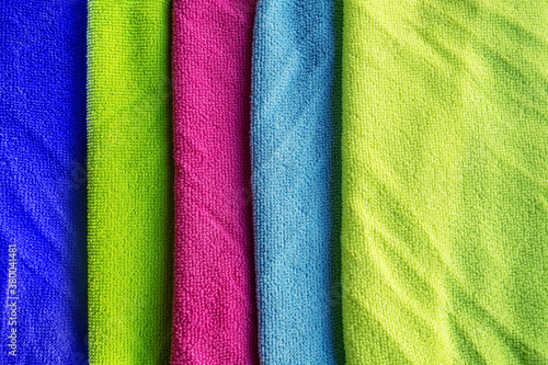 abstract staked colored microfiber rags for cleaning © Mariia