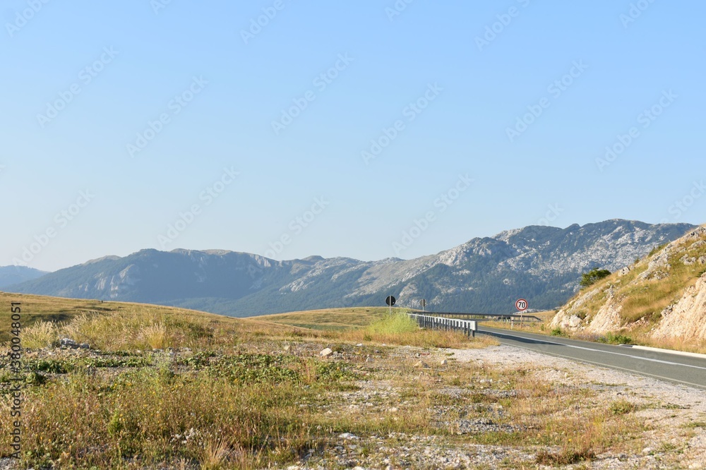 Fototapeta premium A small mountain behind the plain