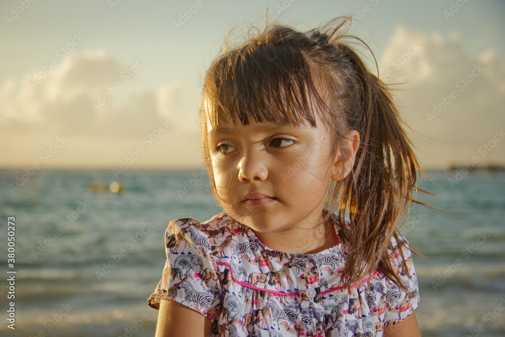 Young Hispanic Girl at the beach at sunrise Young Hispanic Girl at the beach at sunrise