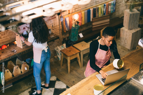 Female owners working in local store.
