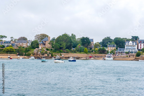 Ile de Brehat, France - August 27, 2019: View of the Port-Clos ferry landing and coastal hotels on Ile de Brehat island in Cotes-d'Armor, Brittany