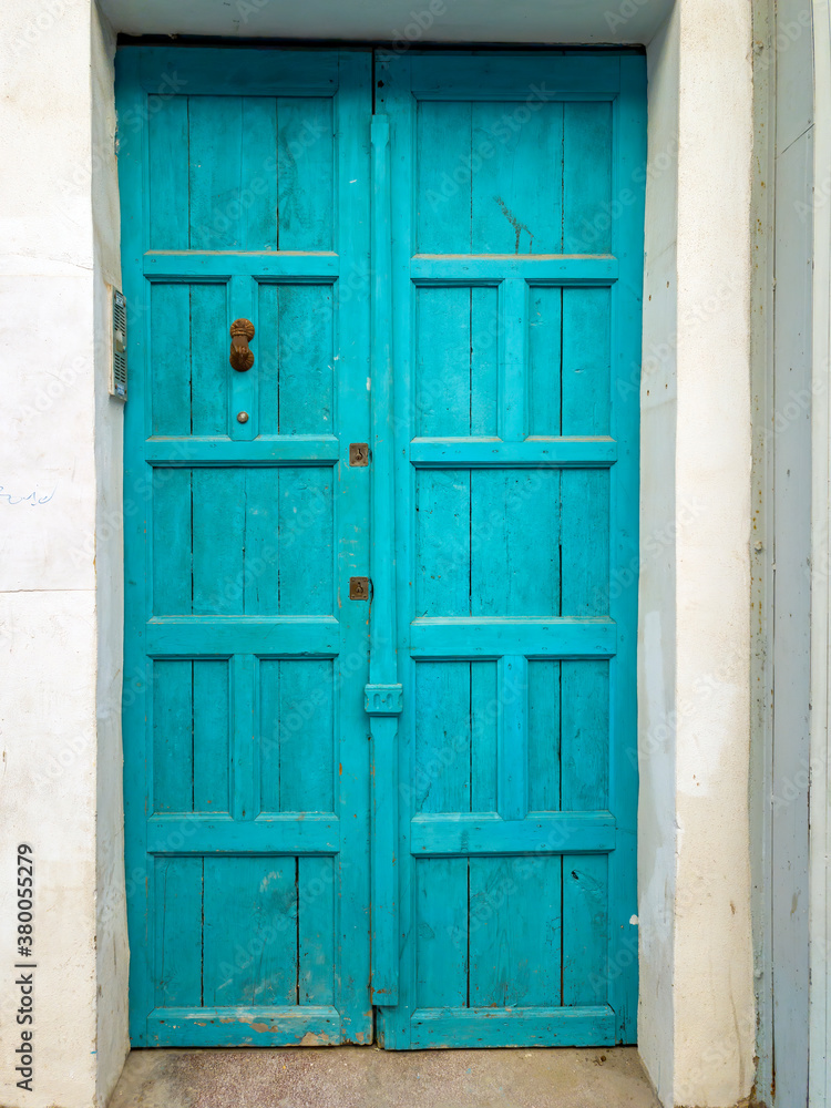Old blue painted wooden door