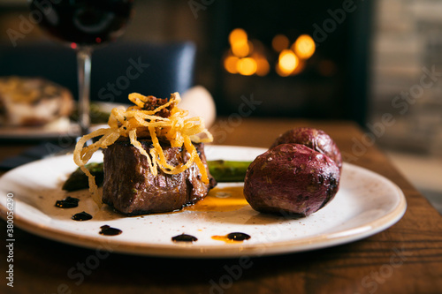 Restaurant: Steak Tenderloin Presented With Potatoes And Asparag photo