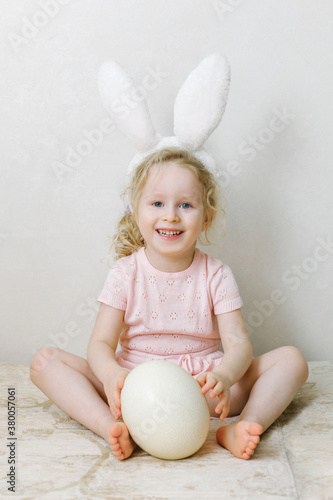 Cheerful girl with the big egg photo