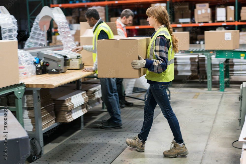 Workers in distribution warehouse Workers in distribution warehouse