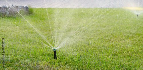 An automatic watering system watering the lawn