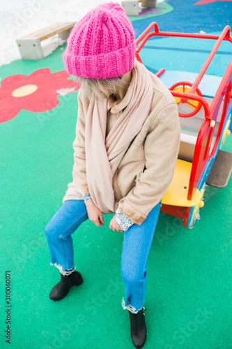 upset young woman on the green background photo